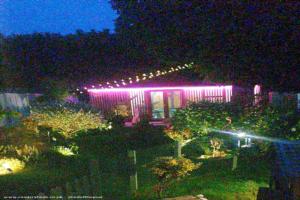 Front view at night time of shed - The shed , Northamptonshire