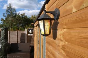 Side view showing lantern and hand made sign of shed - Calico Roasts, Warwickshire