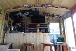 View of TV and flags of shed - Calico Roasts, Warwickshire