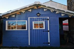 Front view bunting of shed - Posh Blue Shed, Cumbria