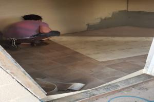 Laying the floor of shed - The Green Dragon, West Midlands