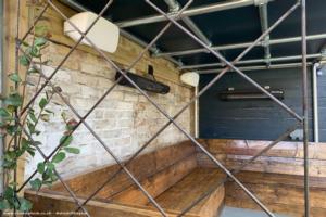 Seating under living canopy of shed - The Duck and Wolverine, Greater London