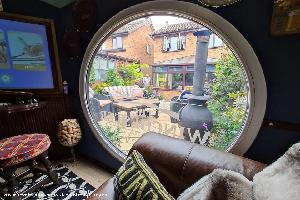 Looking out of the round window of shed - The winchester, Staffordshire