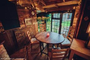 The main table and bay window of shed - The Foxy Stoat, Berkshire