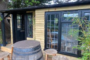Front view with barrel and stalls outside of shed - The Foxy Stoat, Berkshire