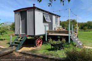 The restored Living Van next to the hut of shed - Drovers Halt, Kent